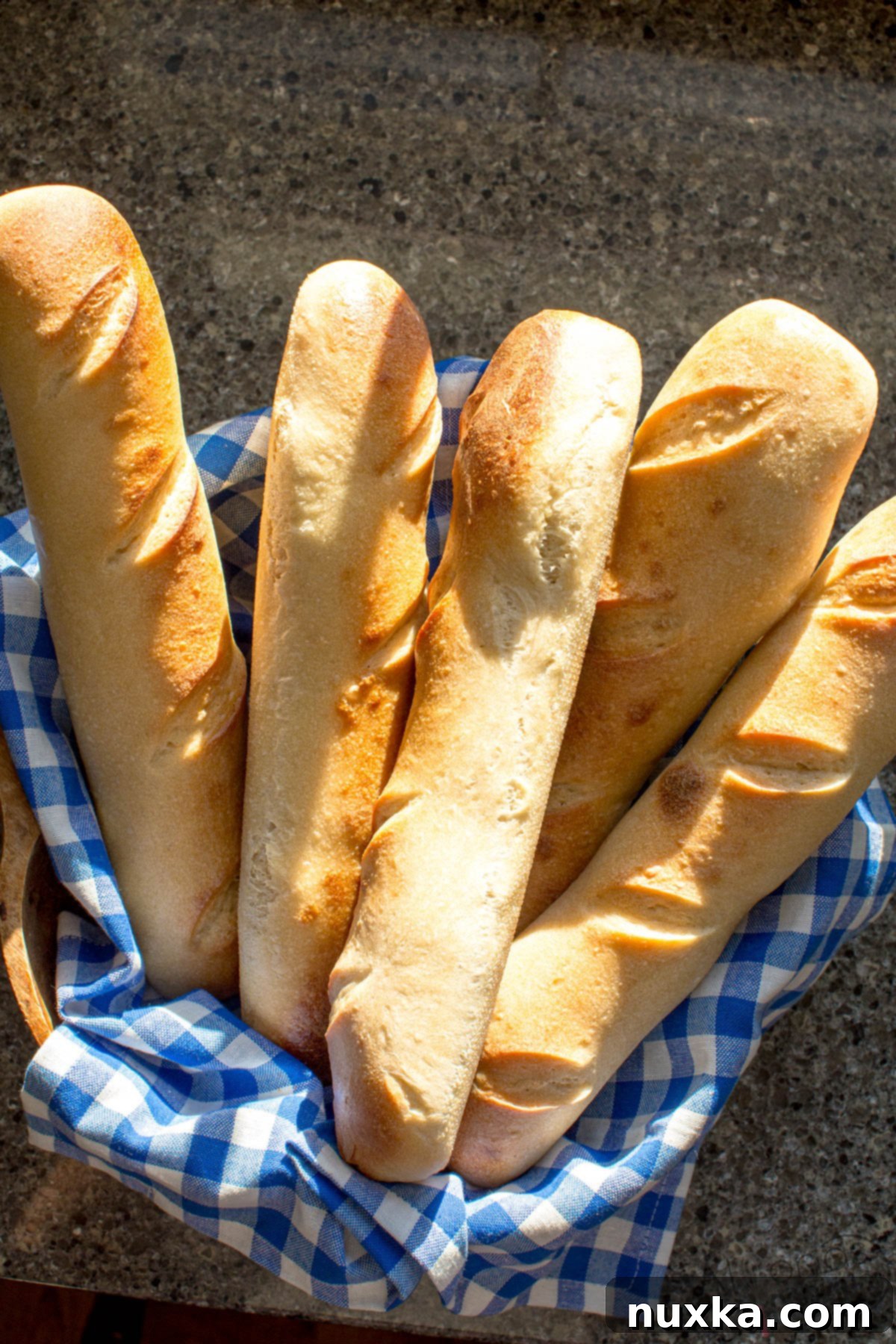 Freshly baked sourdough French bread baguettes with a golden crust