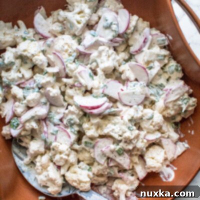 creamy raw cauliflower salad with radish and green onions
