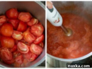 tomato base being blended in a pot