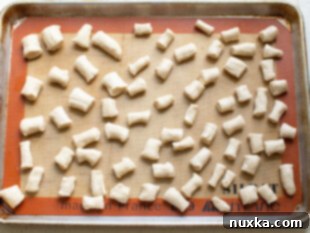 Baked pretzel bites on a baking sheet