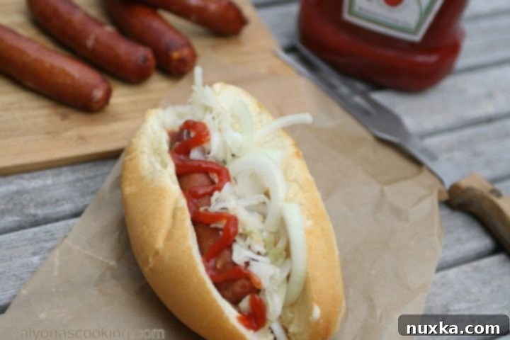 Ukrainian bratwurst sandwiches with sauerkraut, fresh onions, mayonnaise, and ketchup