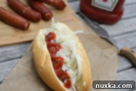 Hearty Bratwurst Kraut Sandwich 3 Ukrainian bratwurst sandwich with sauerkraut and condiments