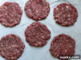 Shaped venison burger patties ready for cooking
