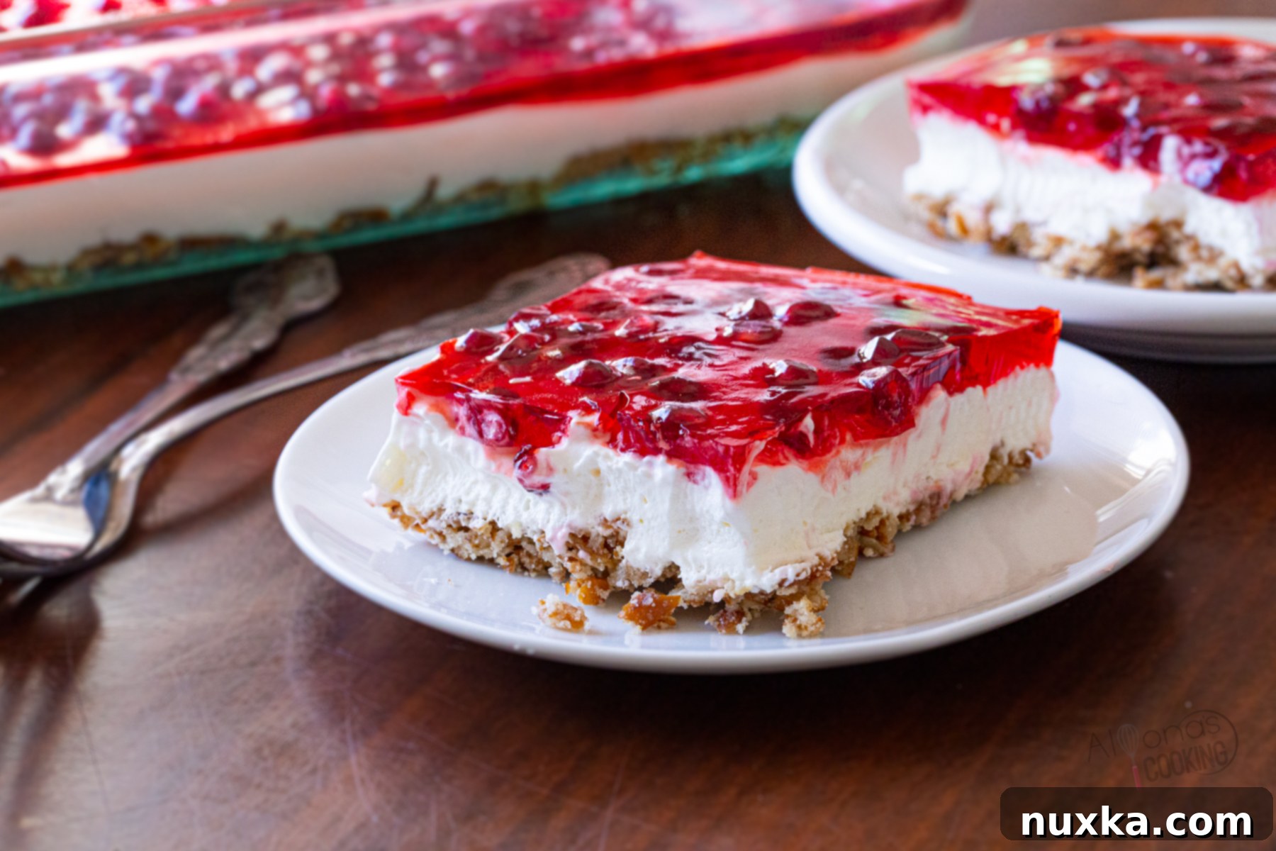 A close-up view of a delicious pretzel dessert with distinct layers