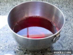 Preparing jello by combining with boiling water