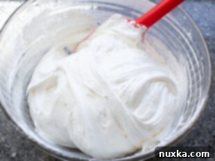 Beating cream cheese and folding in Cool Whip