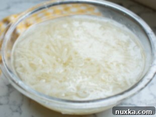 grated potatoes soaking in cold water