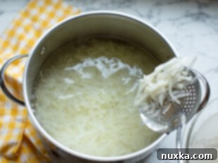 blanching shredded potatoes in boiling water