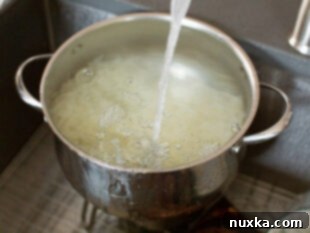 straining blanched potatoes
