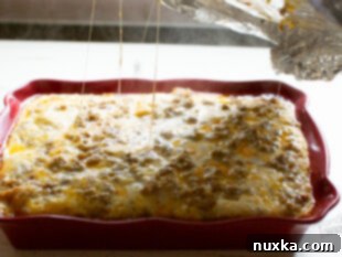 Baked sausage breakfast casserole, golden brown and fluffy.