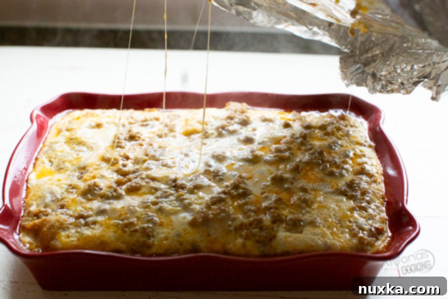 A freshly baked sausage breakfast casserole, golden brown and fluffy, ready to be served for a hearty family breakfast.