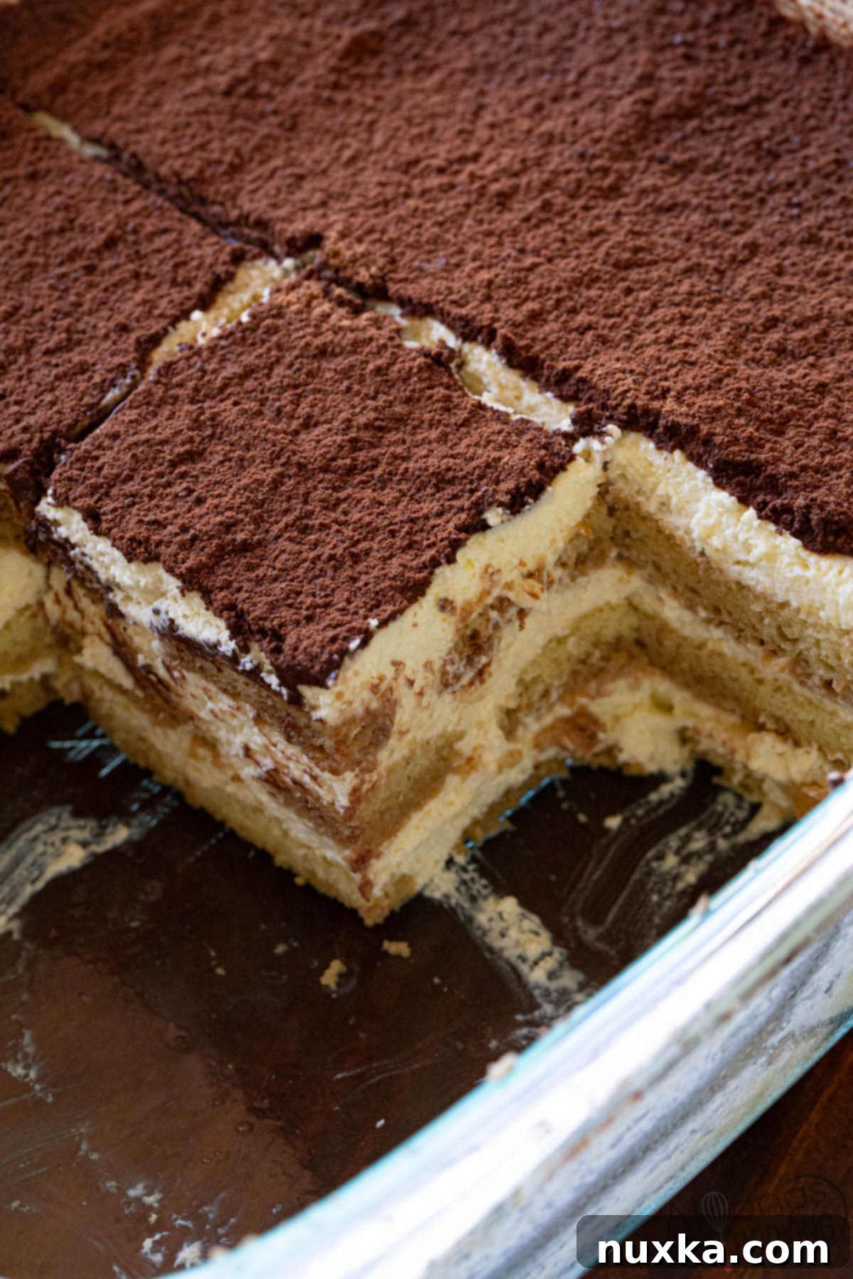 Tiramisu in a square glass dish 