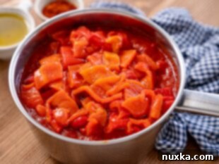 Adding roasted bell peppers to Matbucha