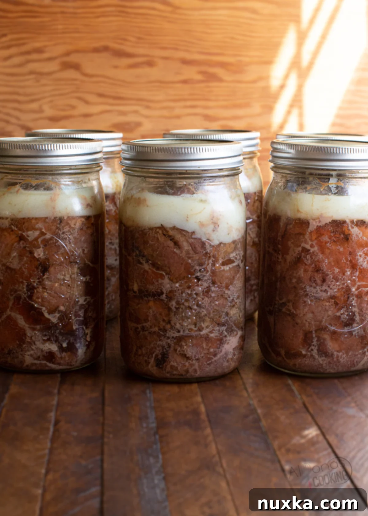 Canned venison, a versatile and shelf-stable meat product, stored in glass jars.