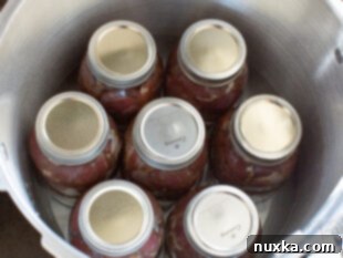 Jars being processed in a pressure canner.
