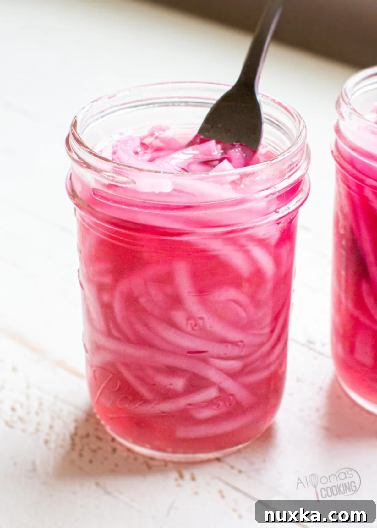pickled red onions in a jar