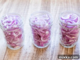 purple onions packed into jars