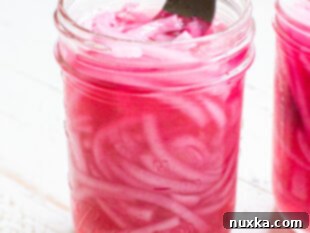 pickled red onions in a jar