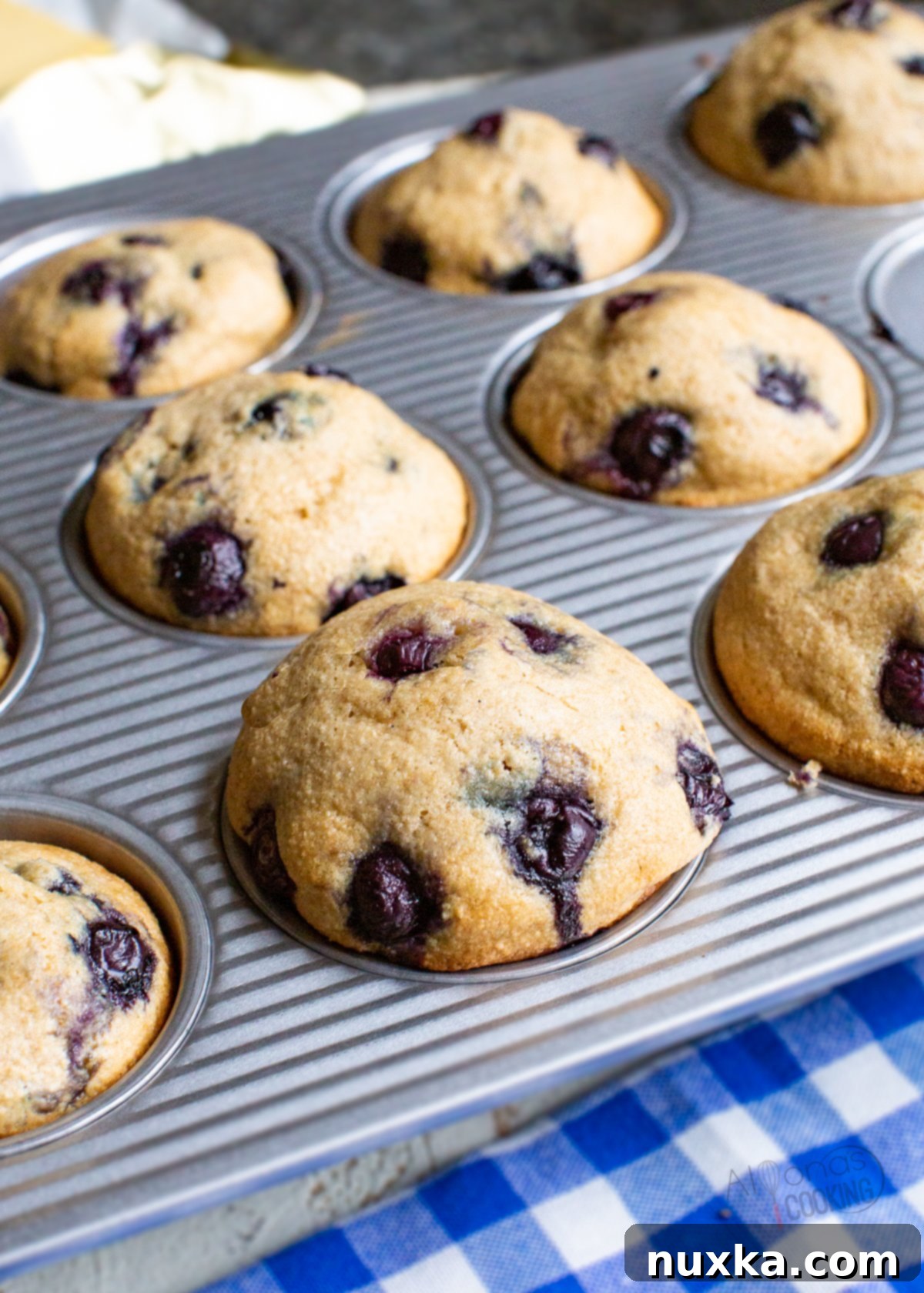 blueberry muffins in a muffin pan 