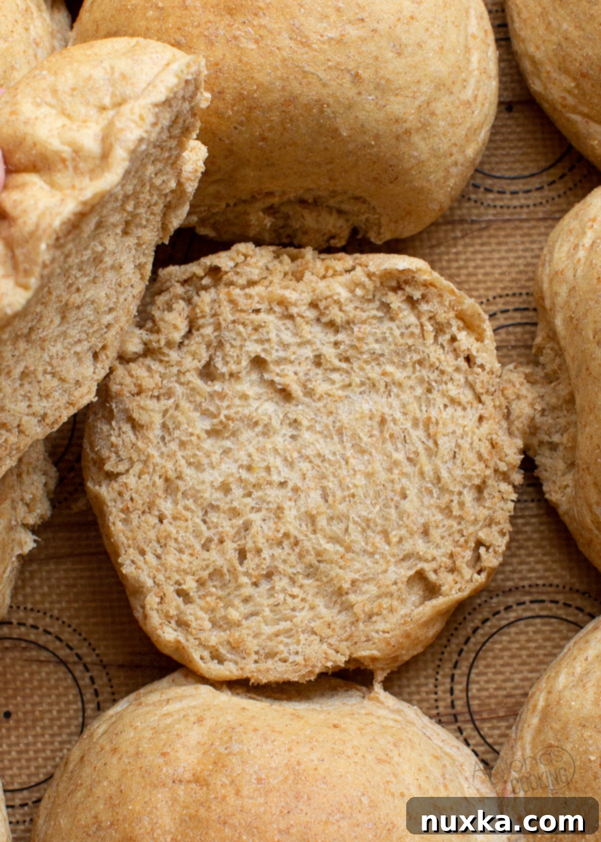 Inside view of a perfectly soft and fluffy homemade whole wheat hamburger bun