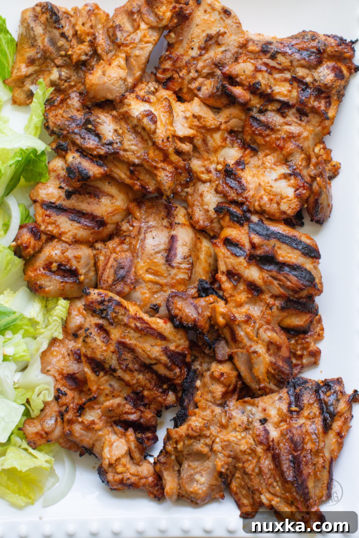 grilled chicken thighs on a platter