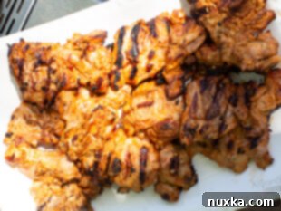 grilled chicken thighs resting on a plate