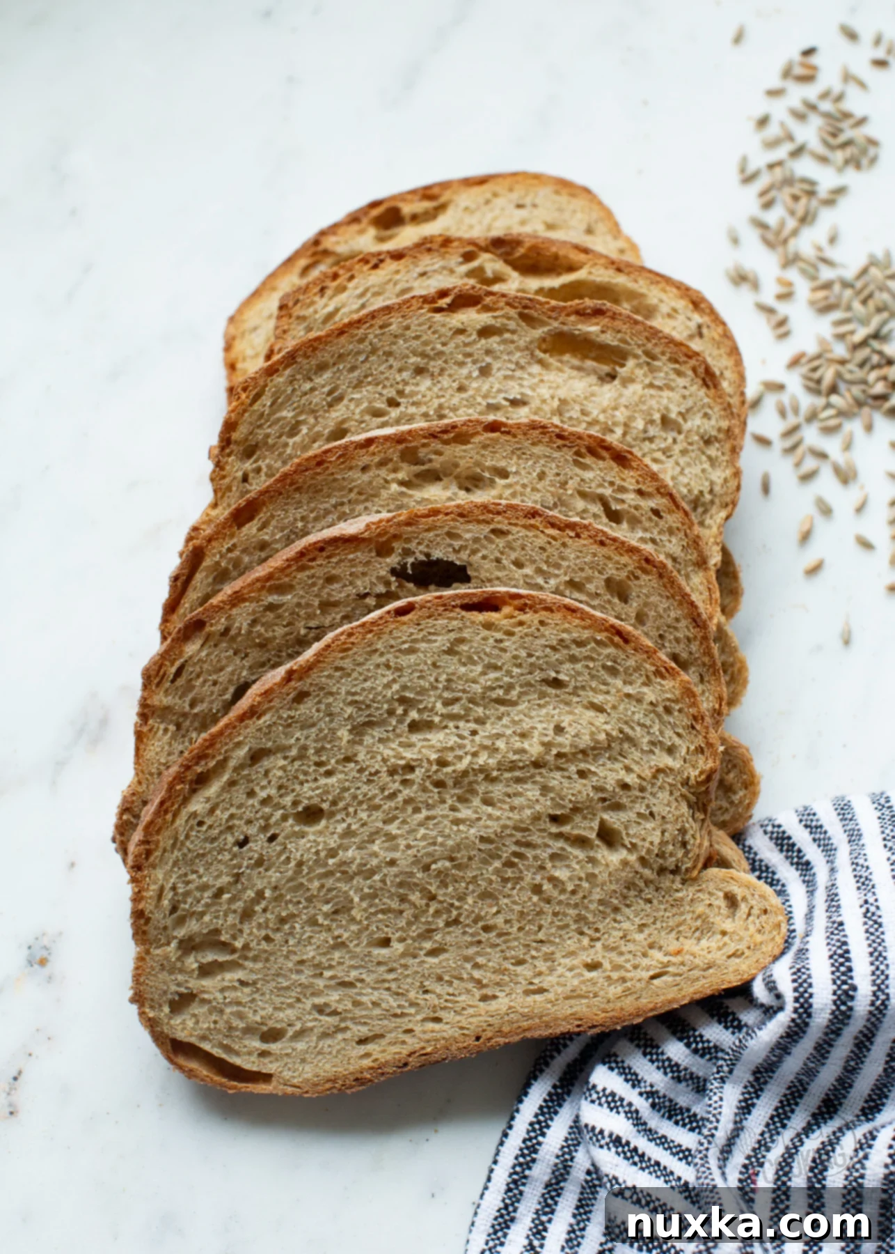 sliced Lithuanian bread showcasing its dark crumb and hearty crust