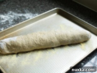Lithuanian loaf rising on a baking sheet
