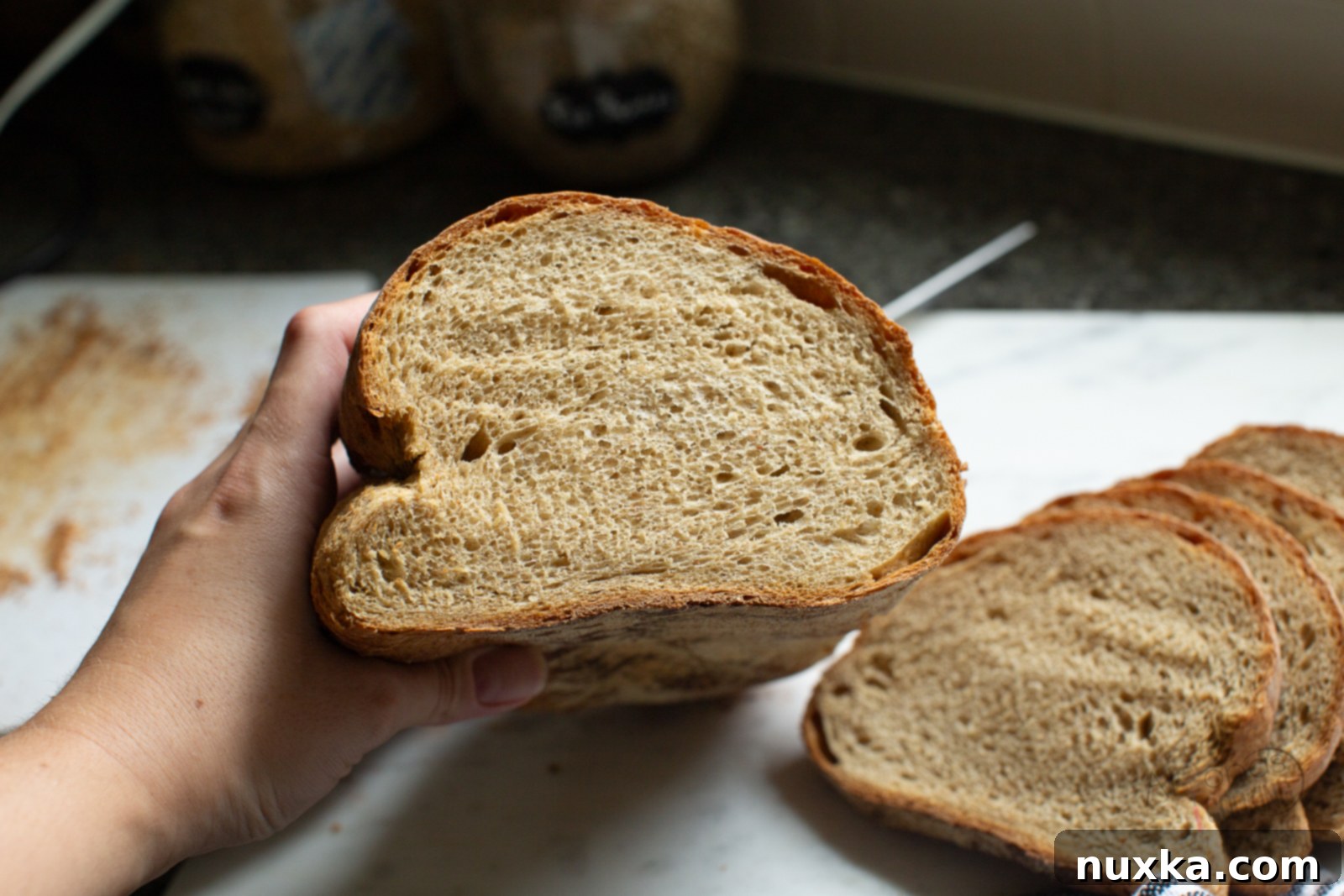 inside of a Lithuanian bread loaf showing its soft, dark crumb