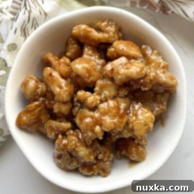 over head view of homemade Panda Express Orange Chicken in a white bowl
