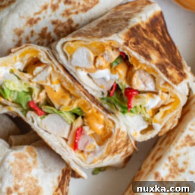 A delicious homemade Chipotle Ranch Grilled Chicken Burrito ready to be enjoyed.