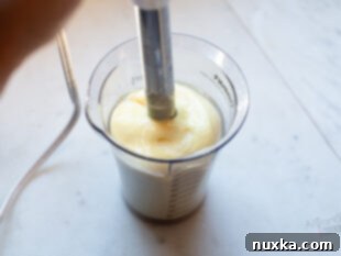 finished mayonnaise in immersion blender cup