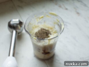 Adding ingredients to Caesar dressing