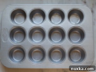 prepared muffin pan for egg bites