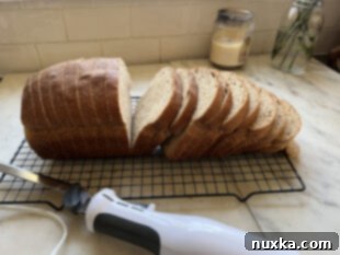 freshly baked whole wheat sandwich bread cooling on wire rack