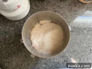 combining ingredients for whole wheat sandwich bread