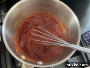 pizza sauce ingredients mixed in a bowl