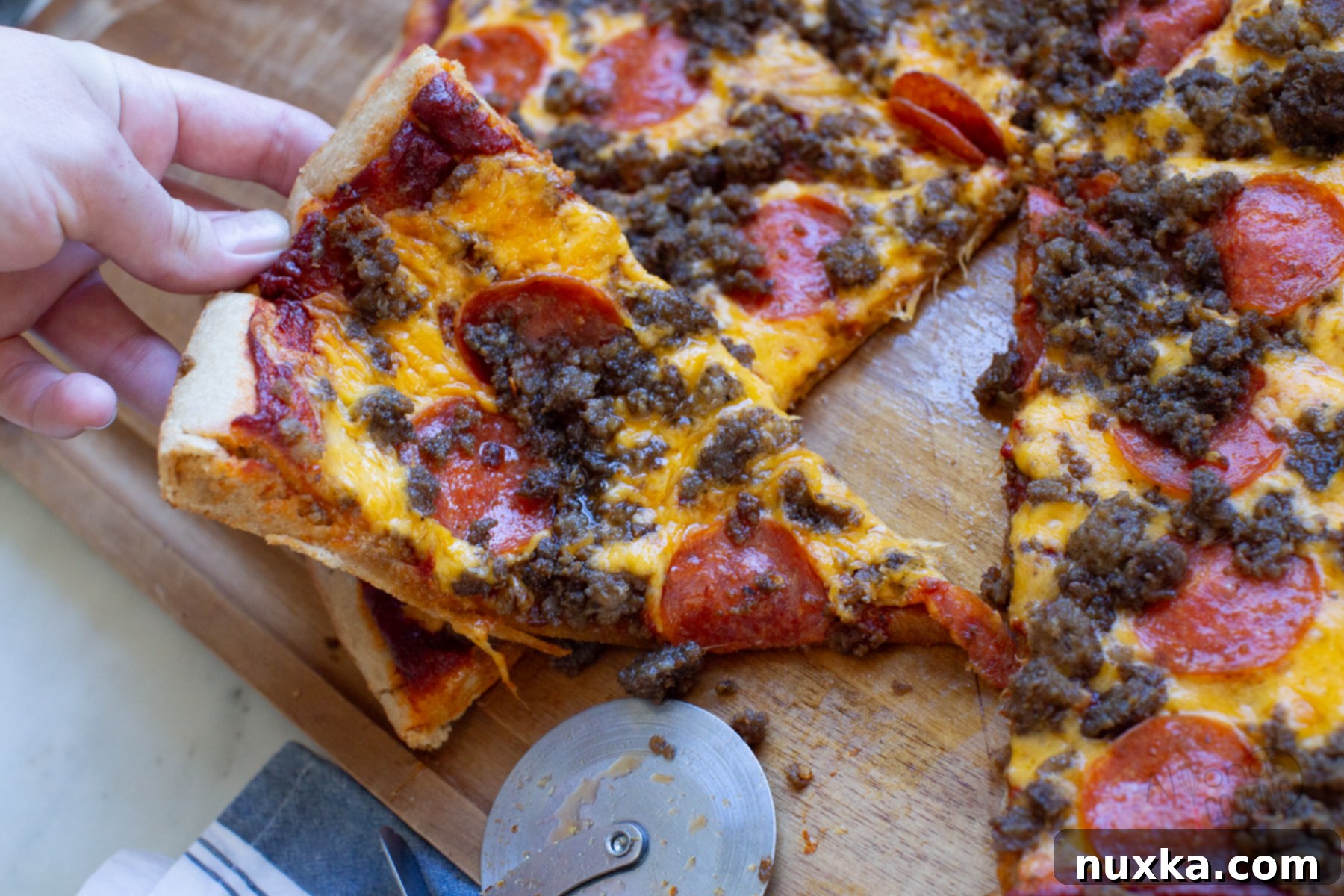 pizza from freshly milled flour, topped with cheese and pepperoni, ready to eat