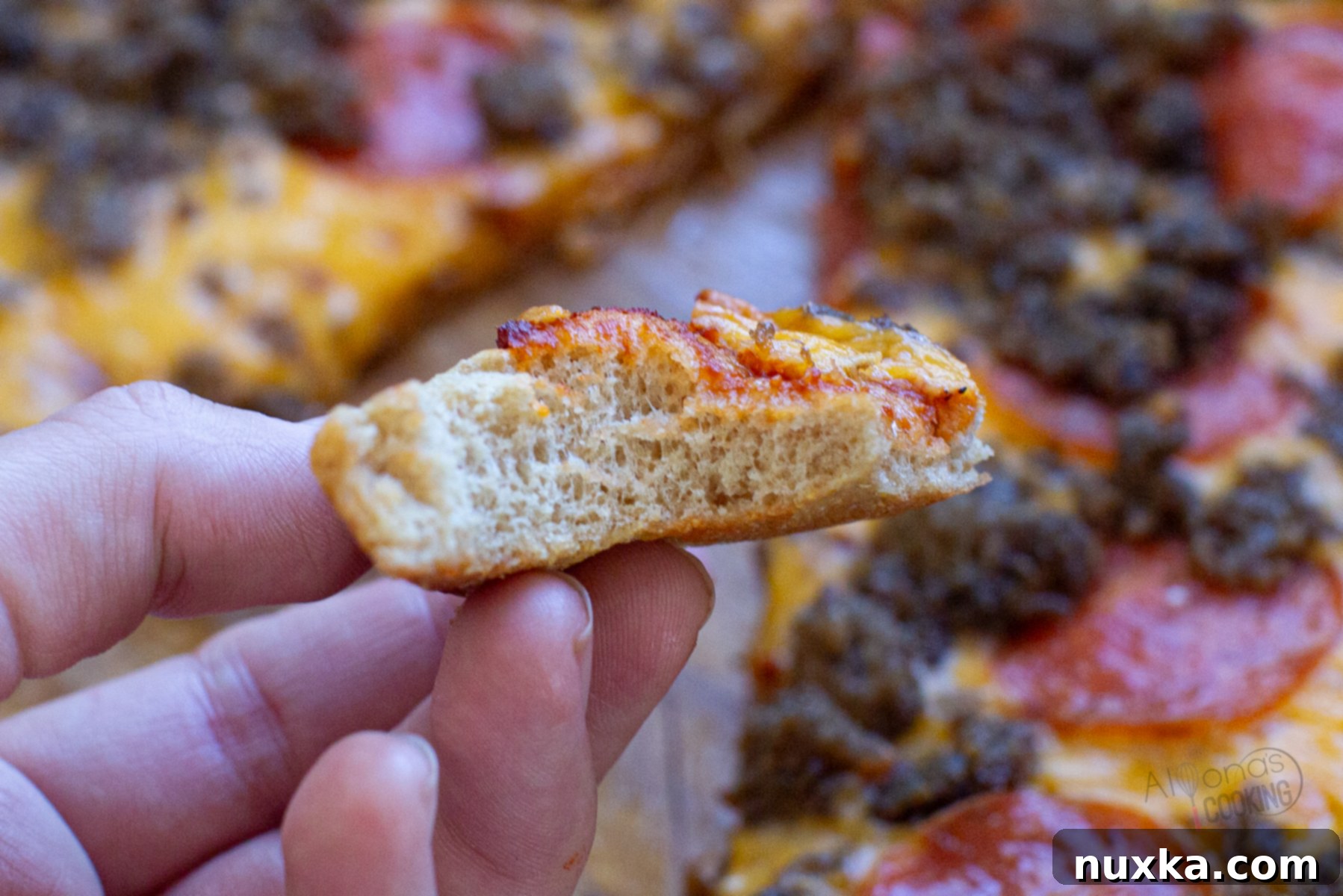 fluffy and chewy pizza dough made from freshly milled flour, showing its soft interior