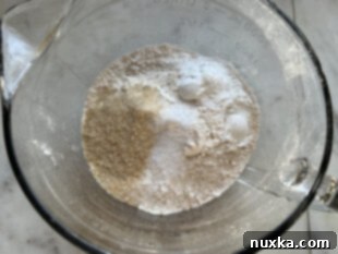 Whisking dry ingredients for whole wheat waffles