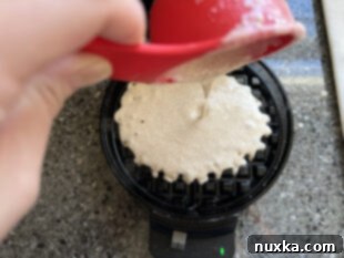 Ladle waffle batter onto waffle maker