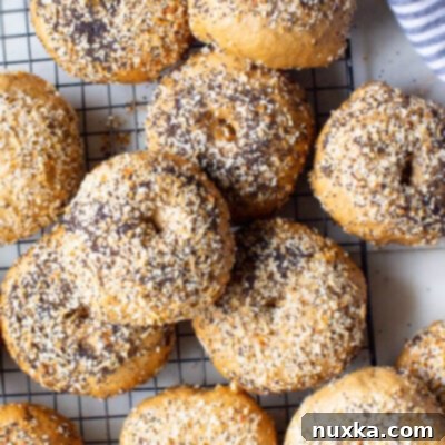 Artisan Whole Wheat Sourdough Bagels with Freshly Milled Flour 4 Freshly baked whole wheat sourdough bagels, golden and chewy, ready to be enjoyed.