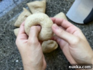 Shaping whole wheat sourdough bagels by poking a hole