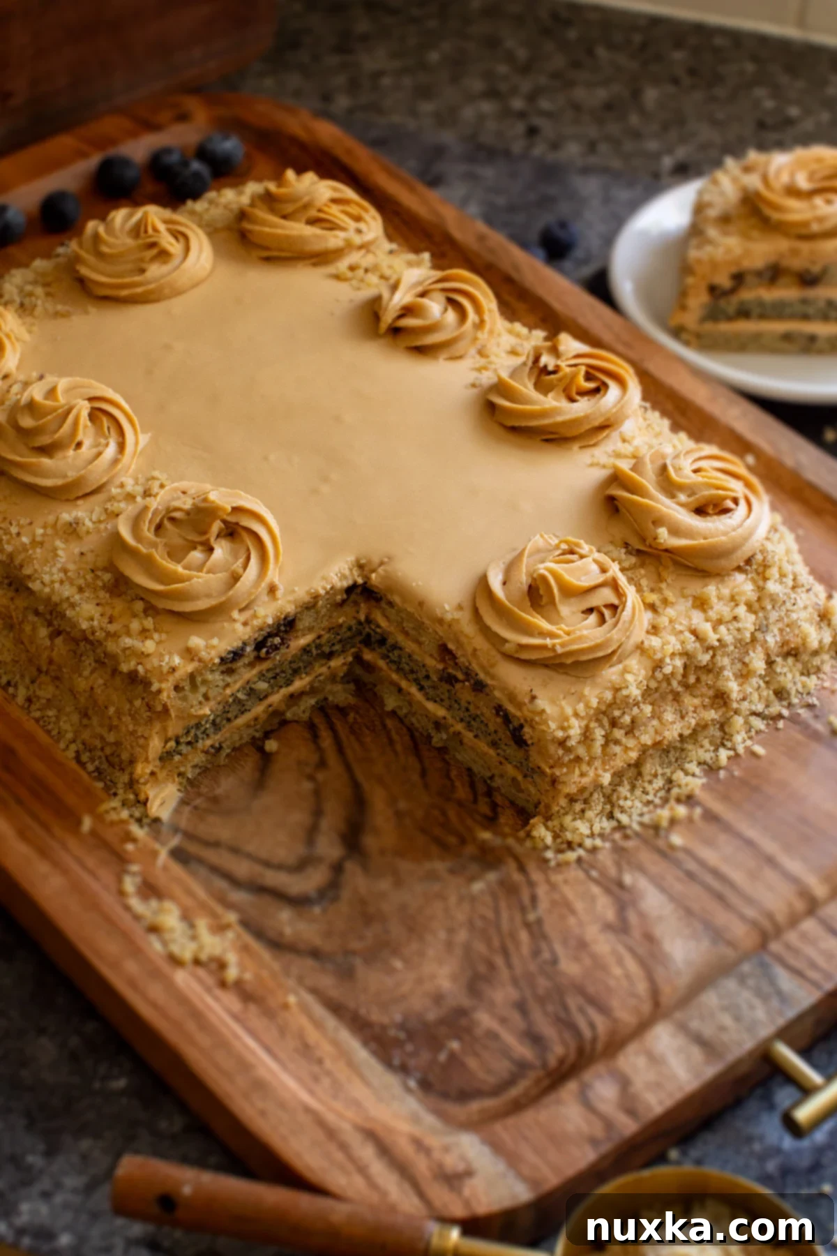 Ukrainian poppy seed cake with walnuts and raisins, beautifully decorated and ready to serve
