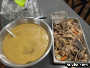 Strained chicken broth separated from bones and solids.