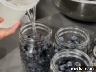 filling grape jars with water
