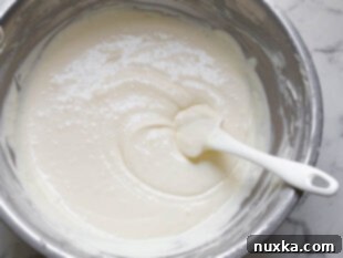 Preparing the raspberry cheesecake batter