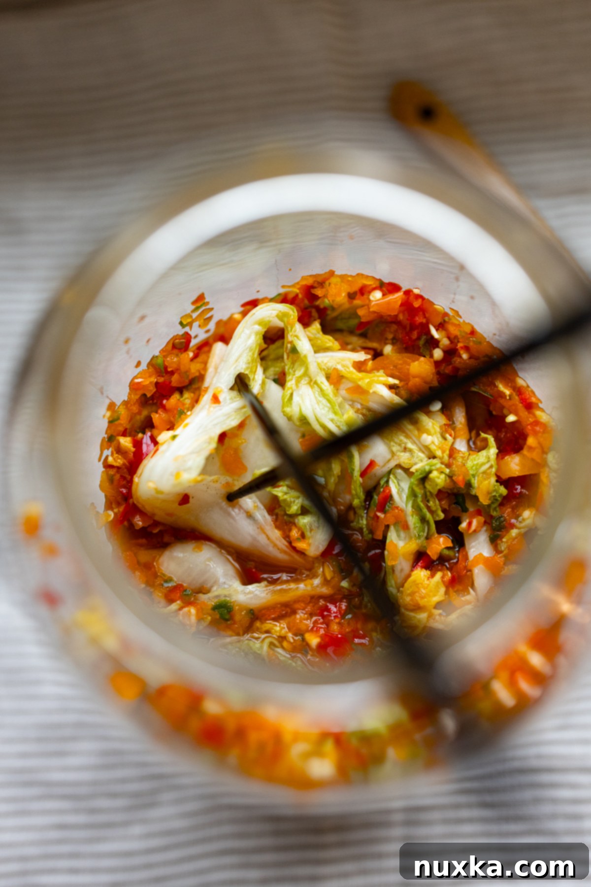 Easy kimchi recipe stored in a glass jar, ready to be enjoyed as a side dish