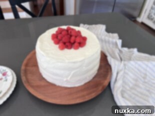 garnished and decorated raspberry honey cake
