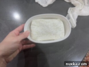 Freshly made kefir cream cheese being shaped